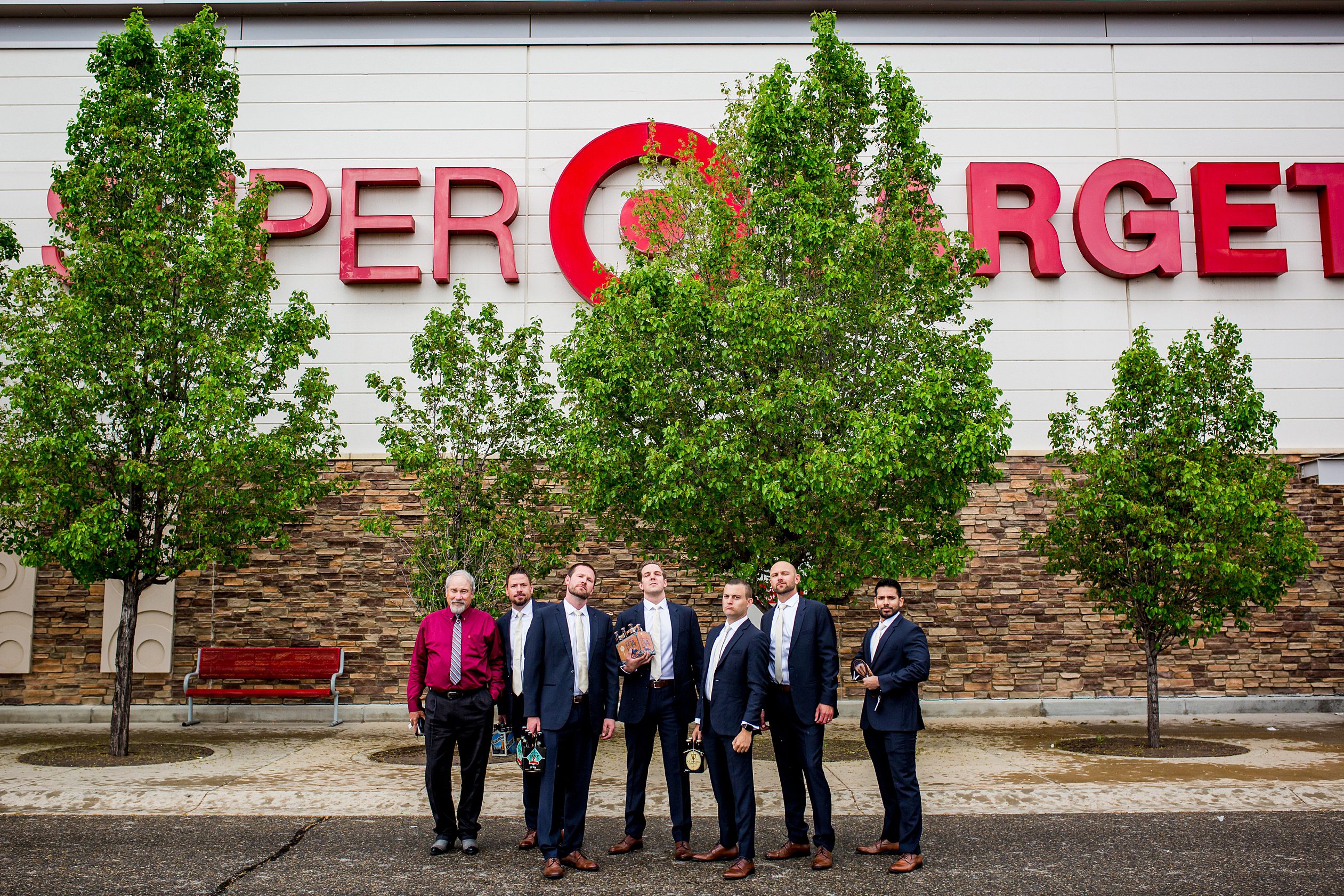 groomsmen pose outside of Target Colorado wedding
