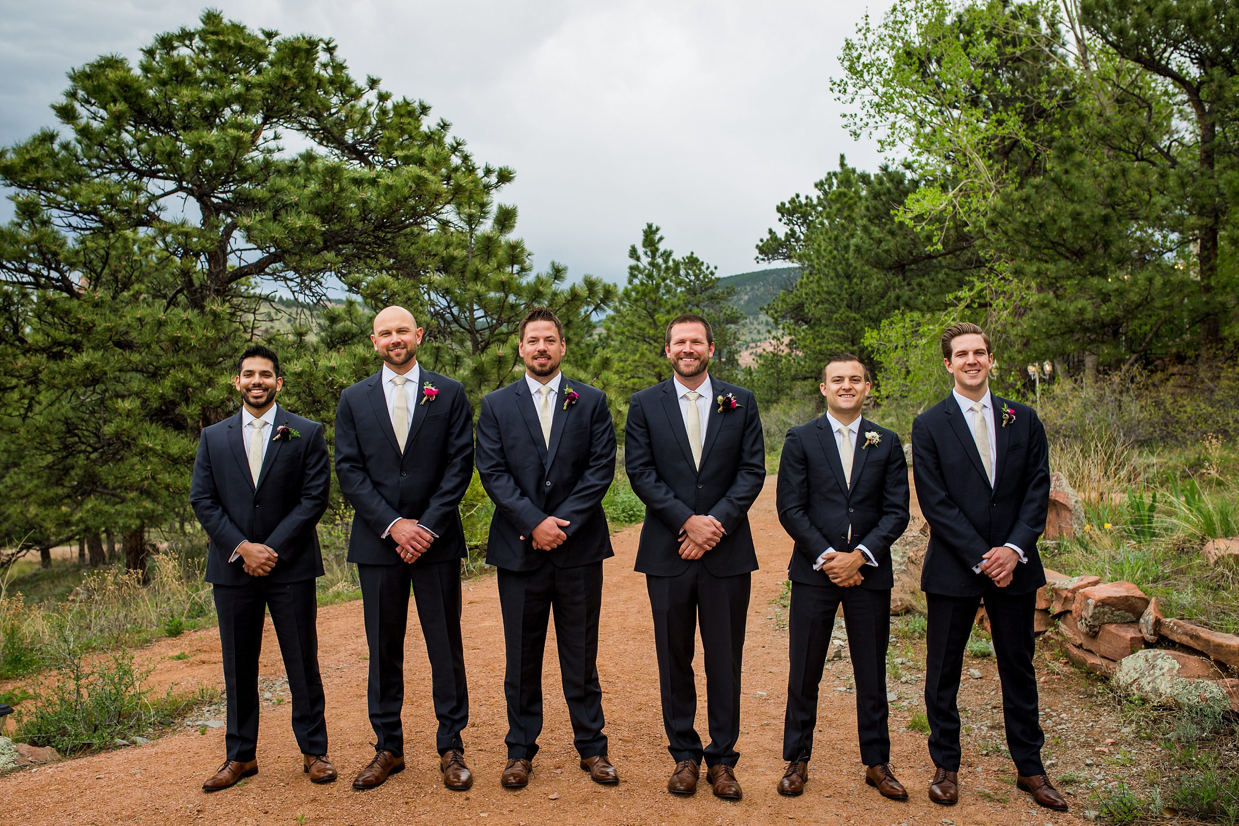 groomsmen outside of the Colorado wedding venue in Lyons, CO