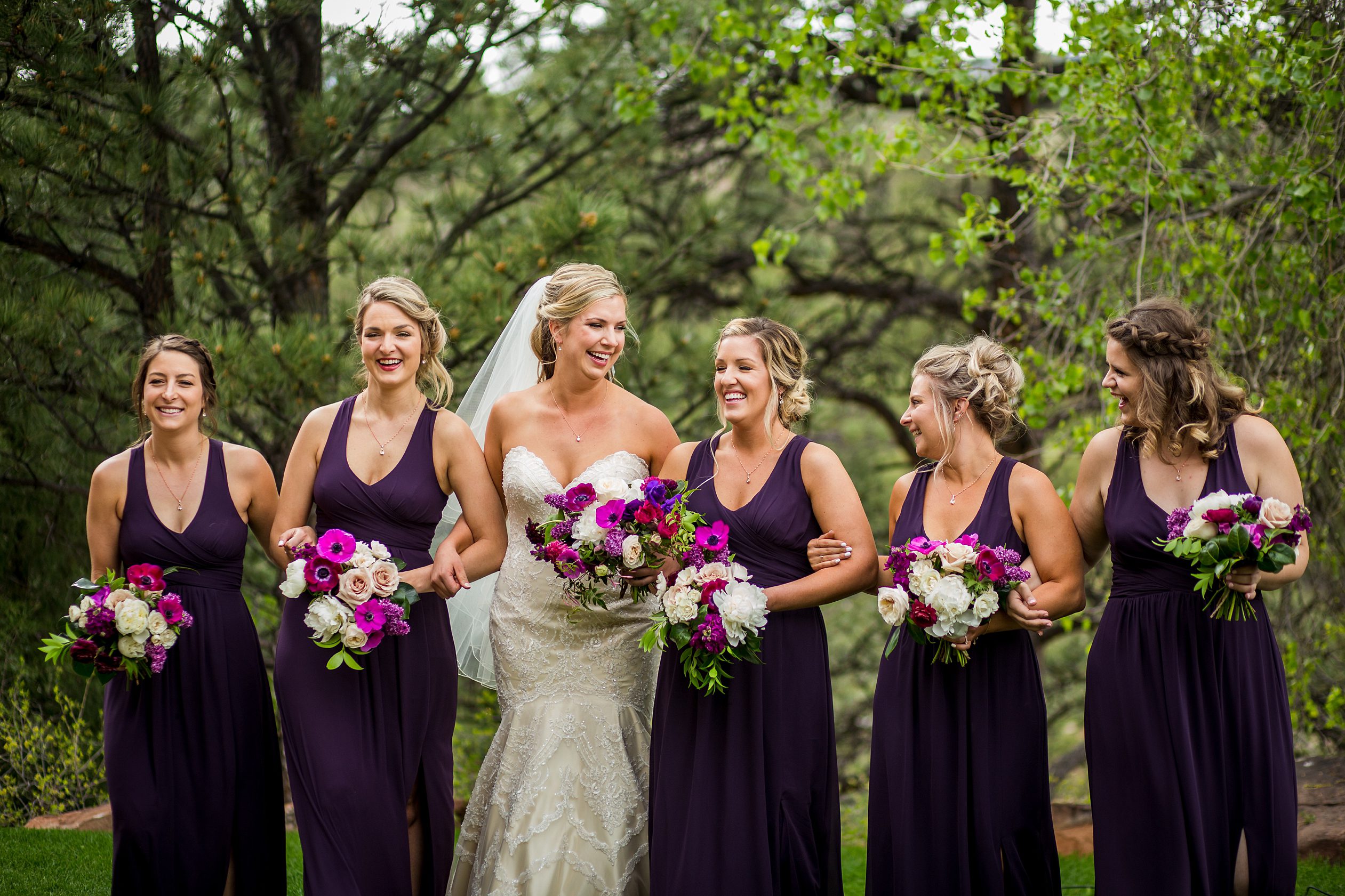 bride and her bridesmaids outside of their Lyons, Colorado wedding venue
