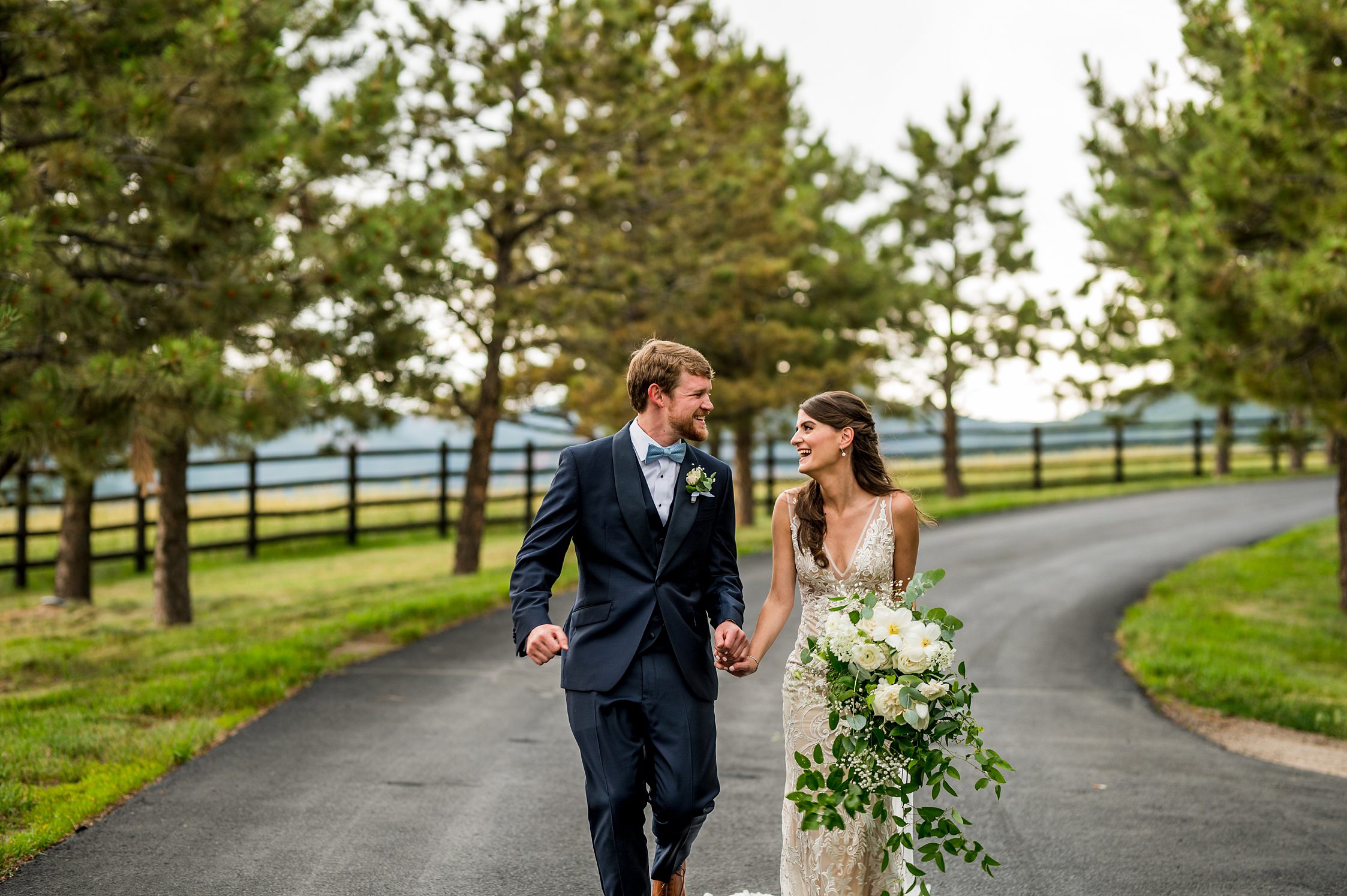 bride and groom laughing at spruce mountain ranch