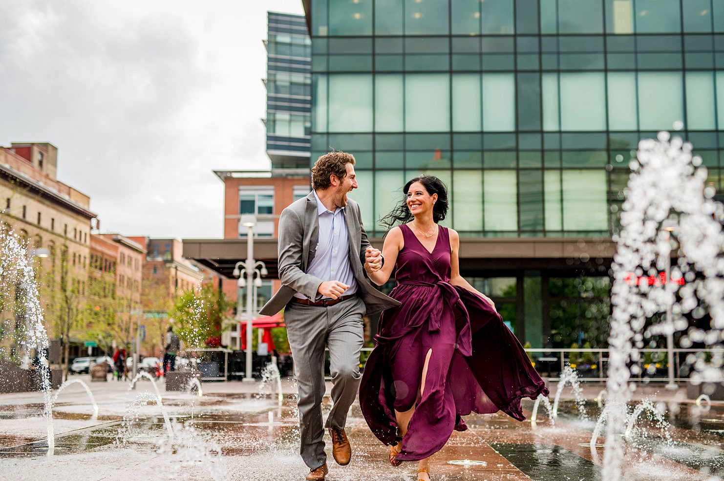 couple running through the fountain at Union Station