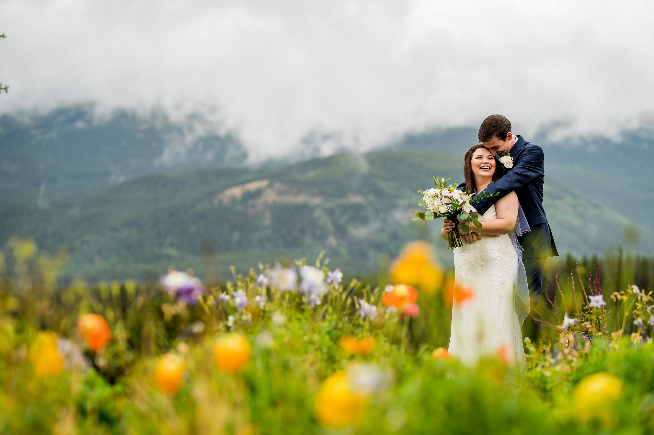 bride and groom laughing at their Colorado wedding venue