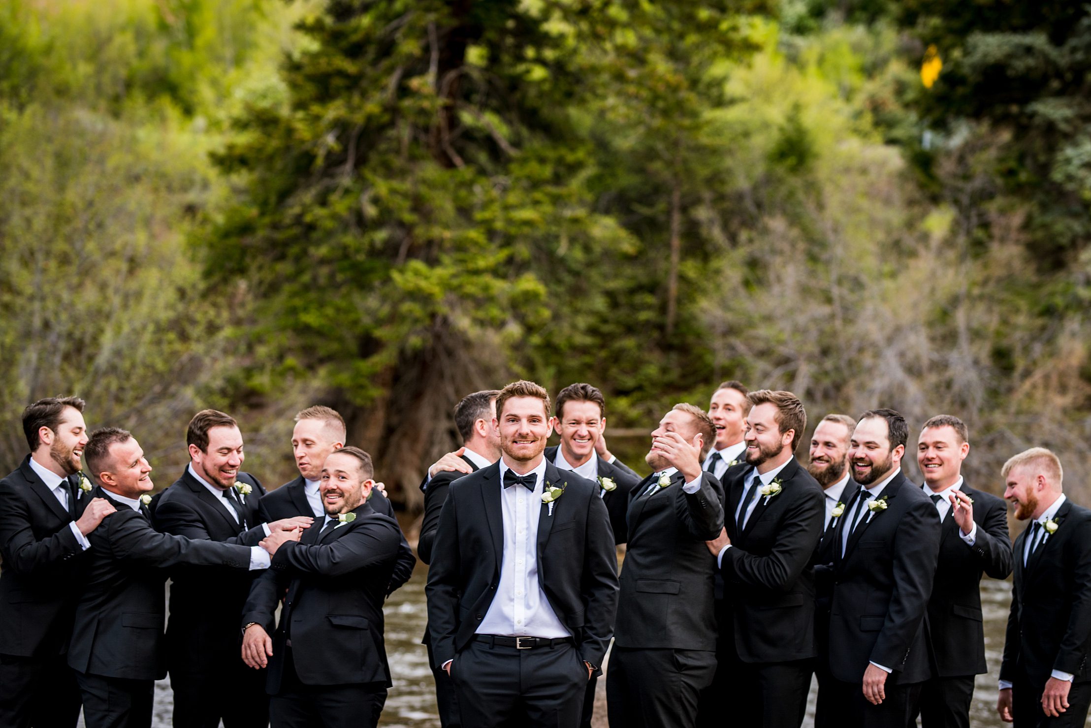 Groomsmen having fun before the wedding ceremony in Colorado
