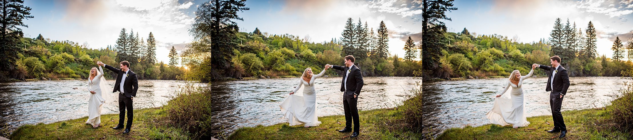 groom spins his bride with the trees and river behind them