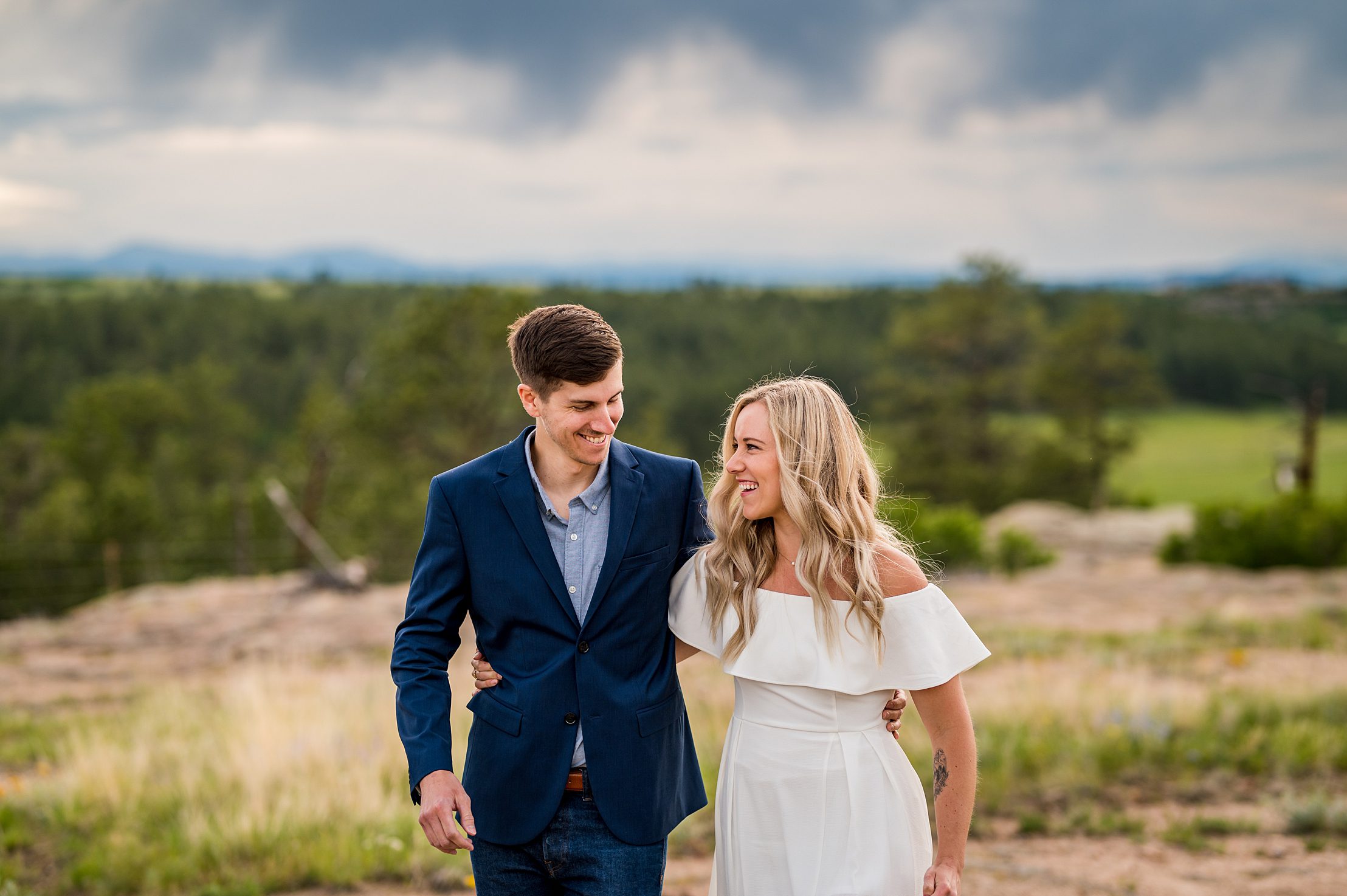 couple laughing and walking at the Colorado park