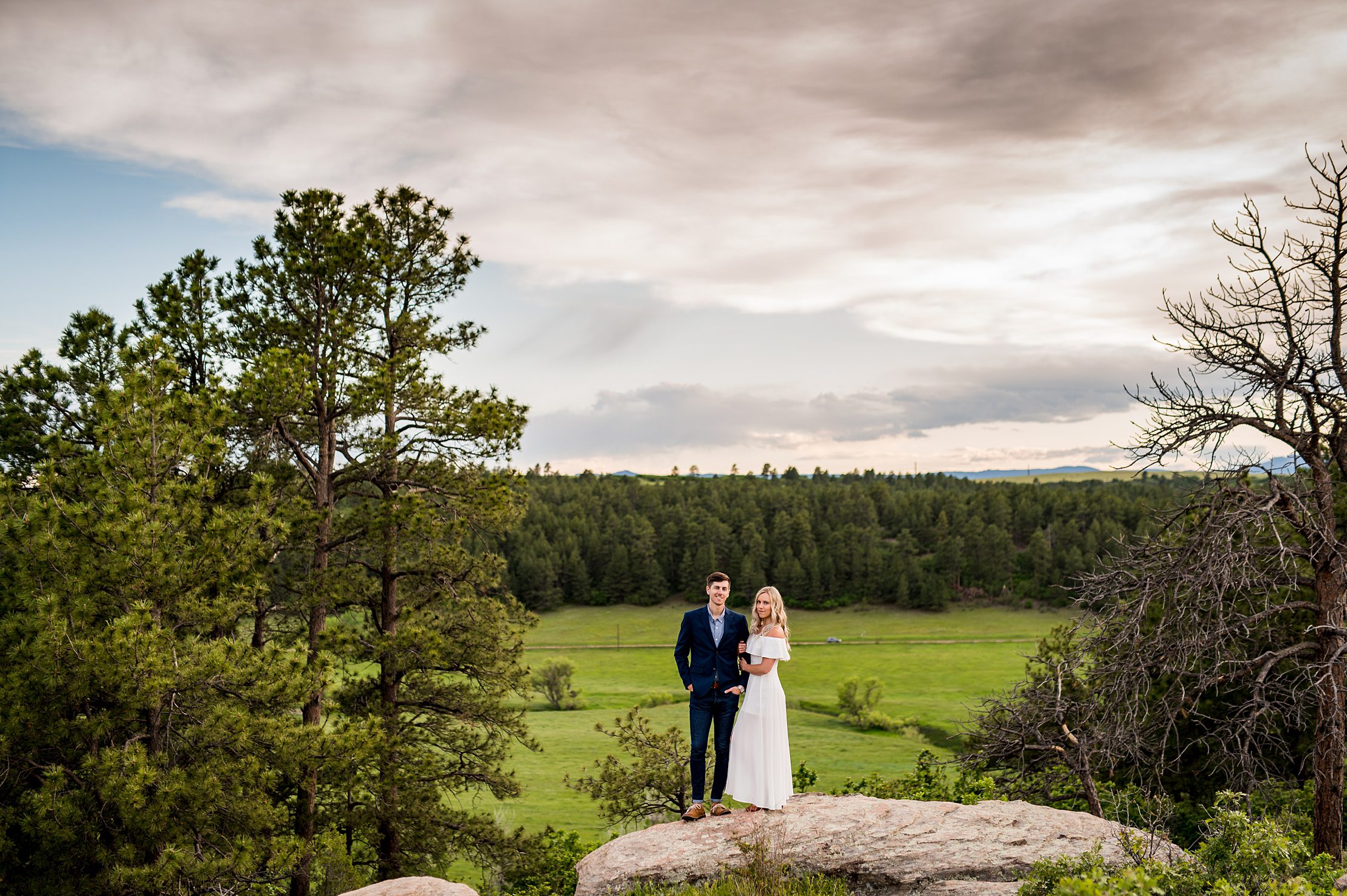 bride to be hugging her fiancé at Castlewood Canyon