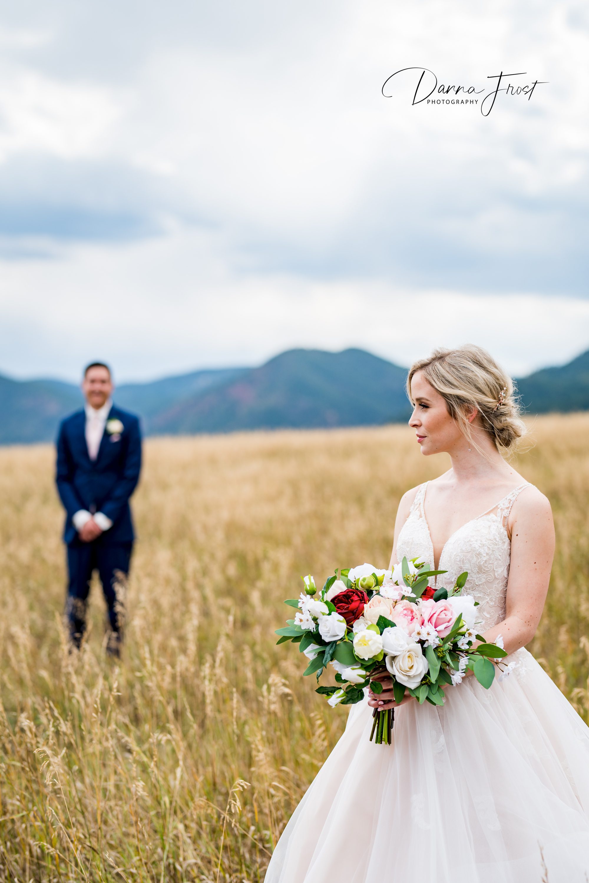 bride and groom in an open field in Colorado 