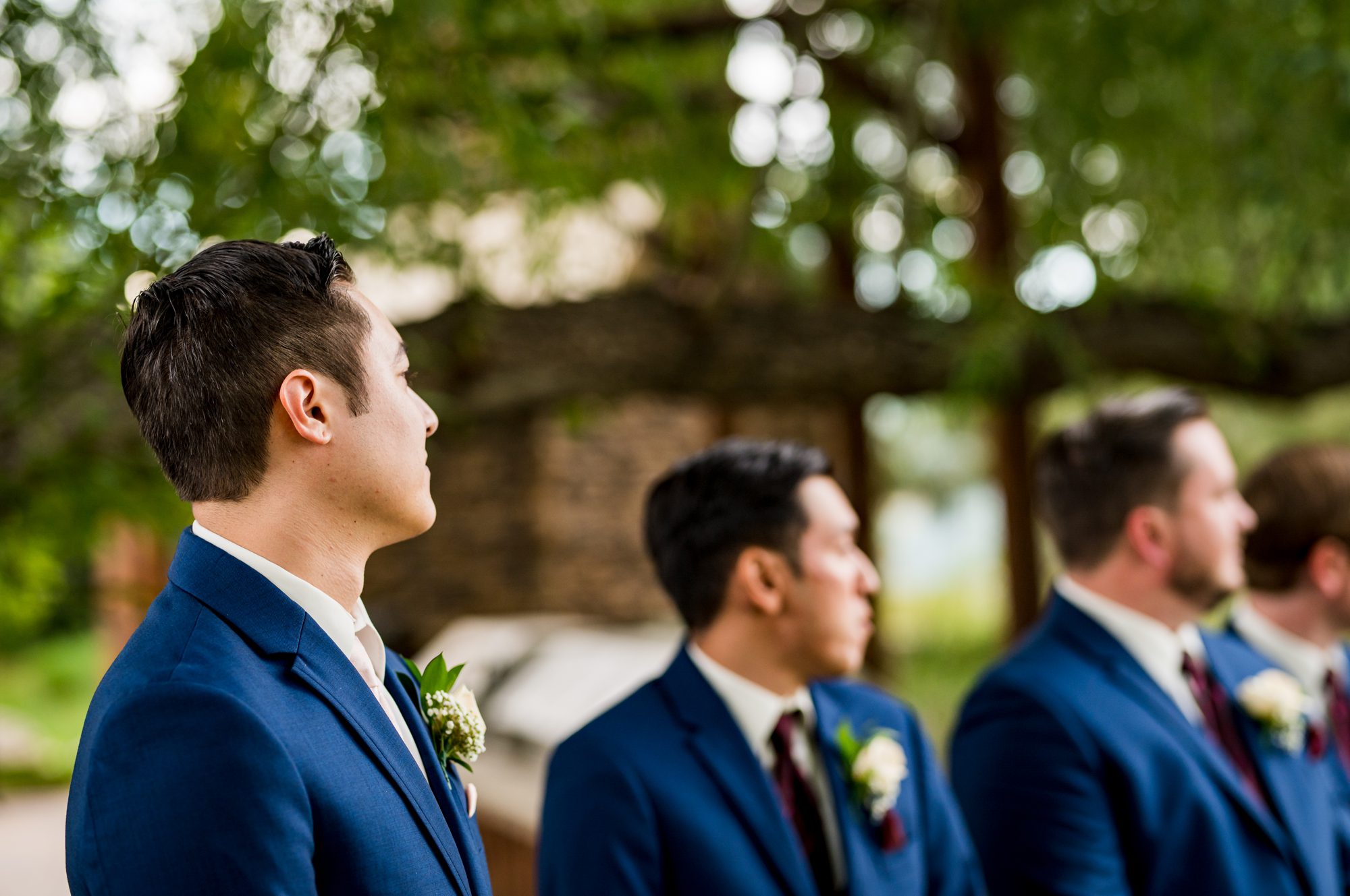 groom watching as his bride walks down the isle at spruce mountain ranch 
