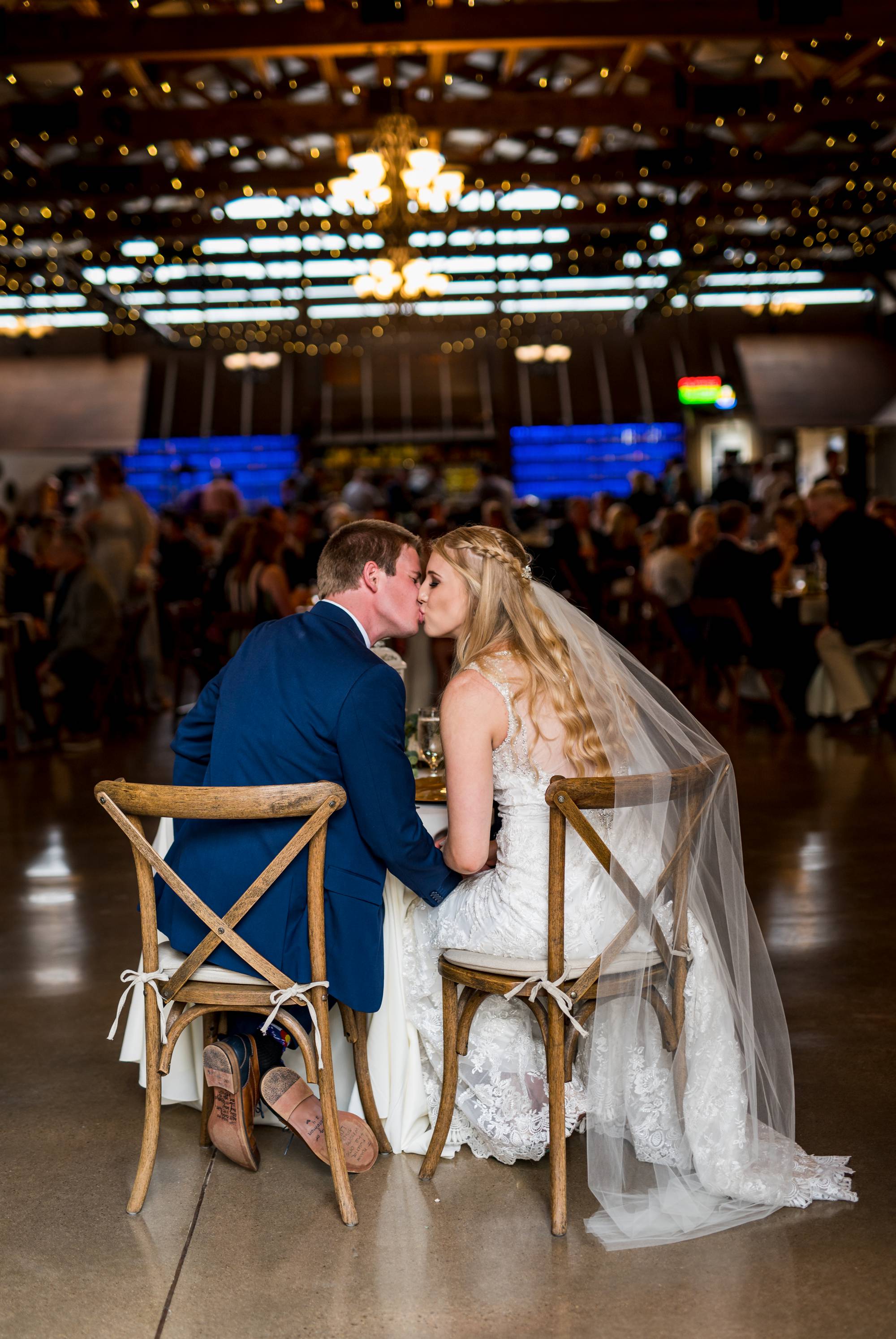 wedding couple kiss at their reception