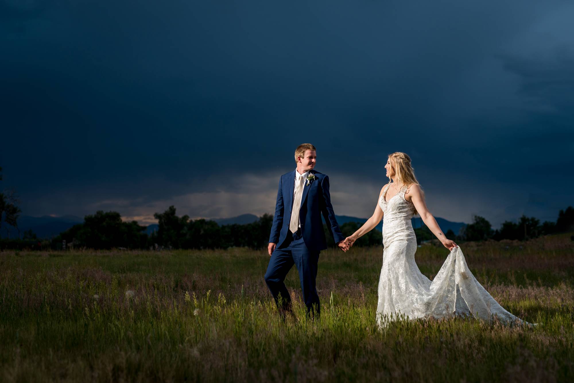 wedding couple at night durning a rain storm in Denver, CO