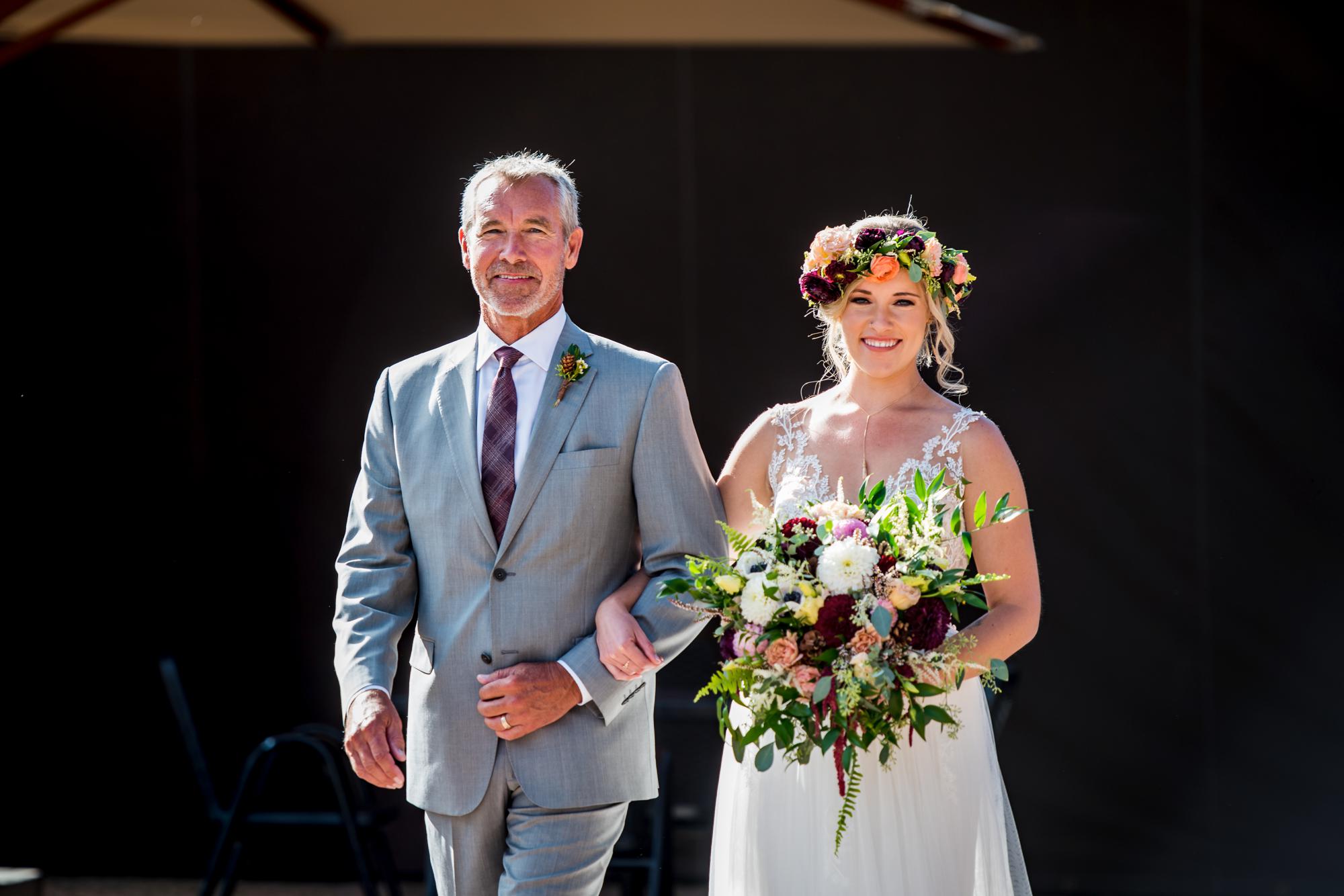 bride and her father walking down the isle at Ten Mile Station