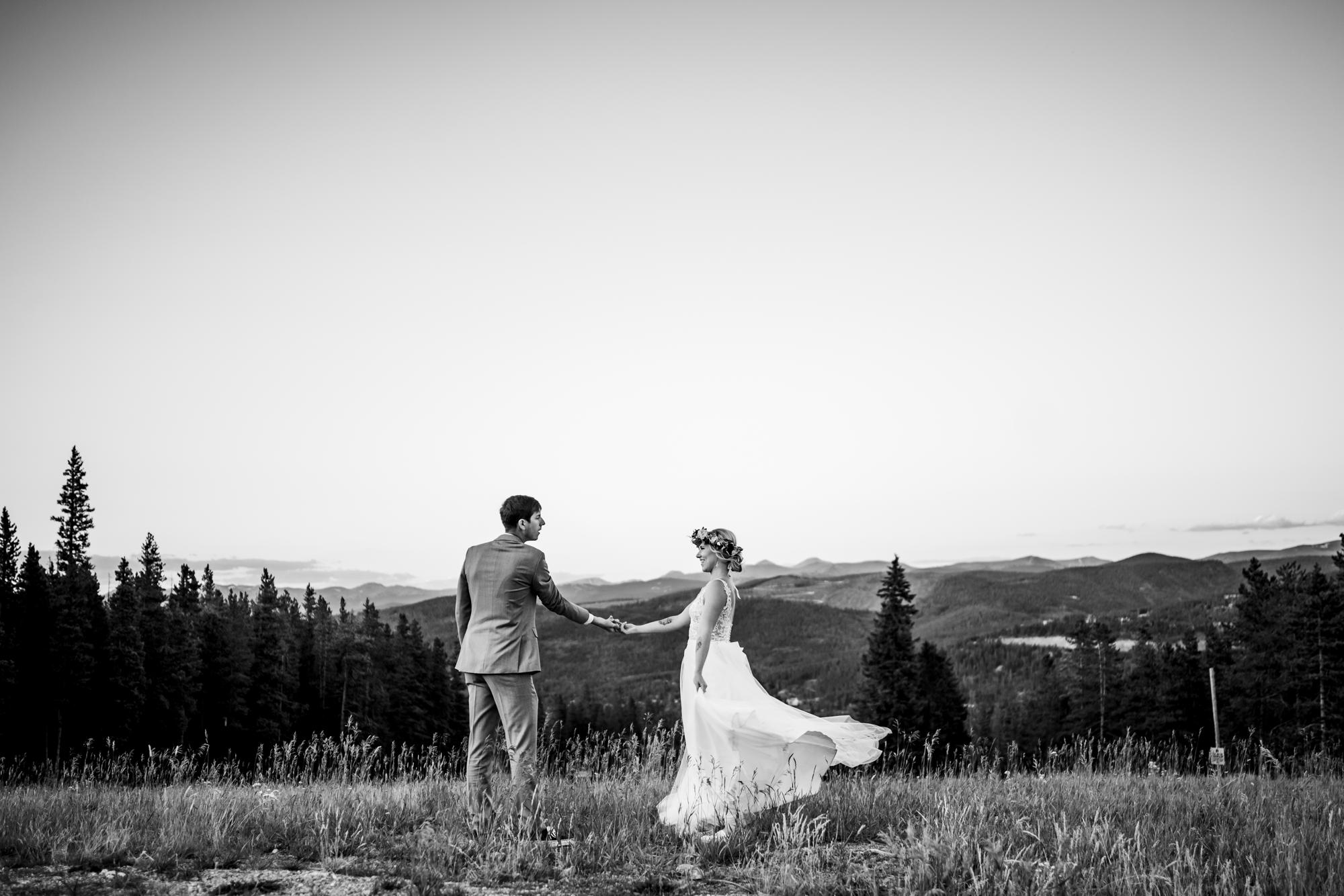 groom spinning is Colorado bride in the mountains of Colorado