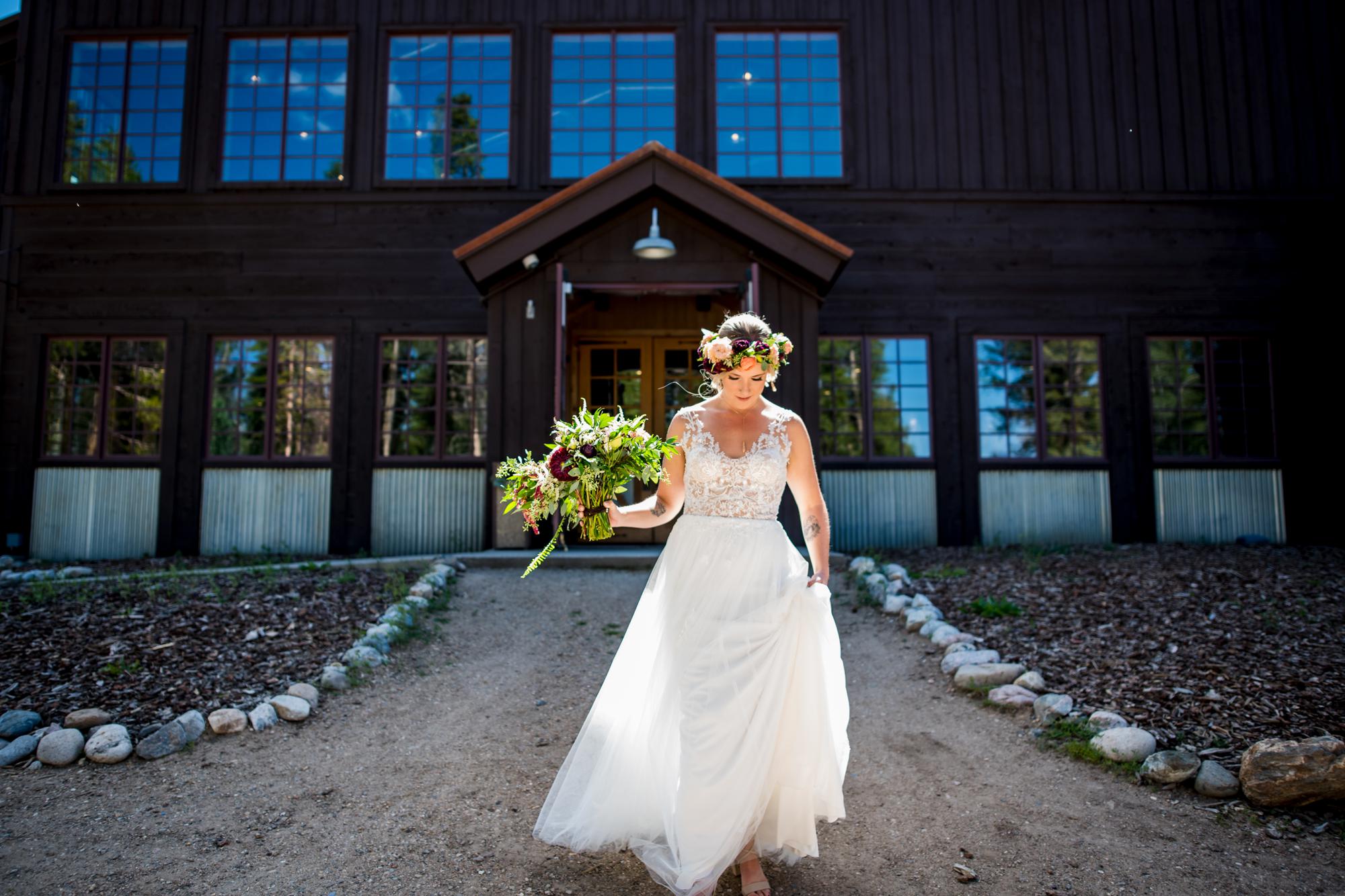 Breckenridge bride walking to her first look