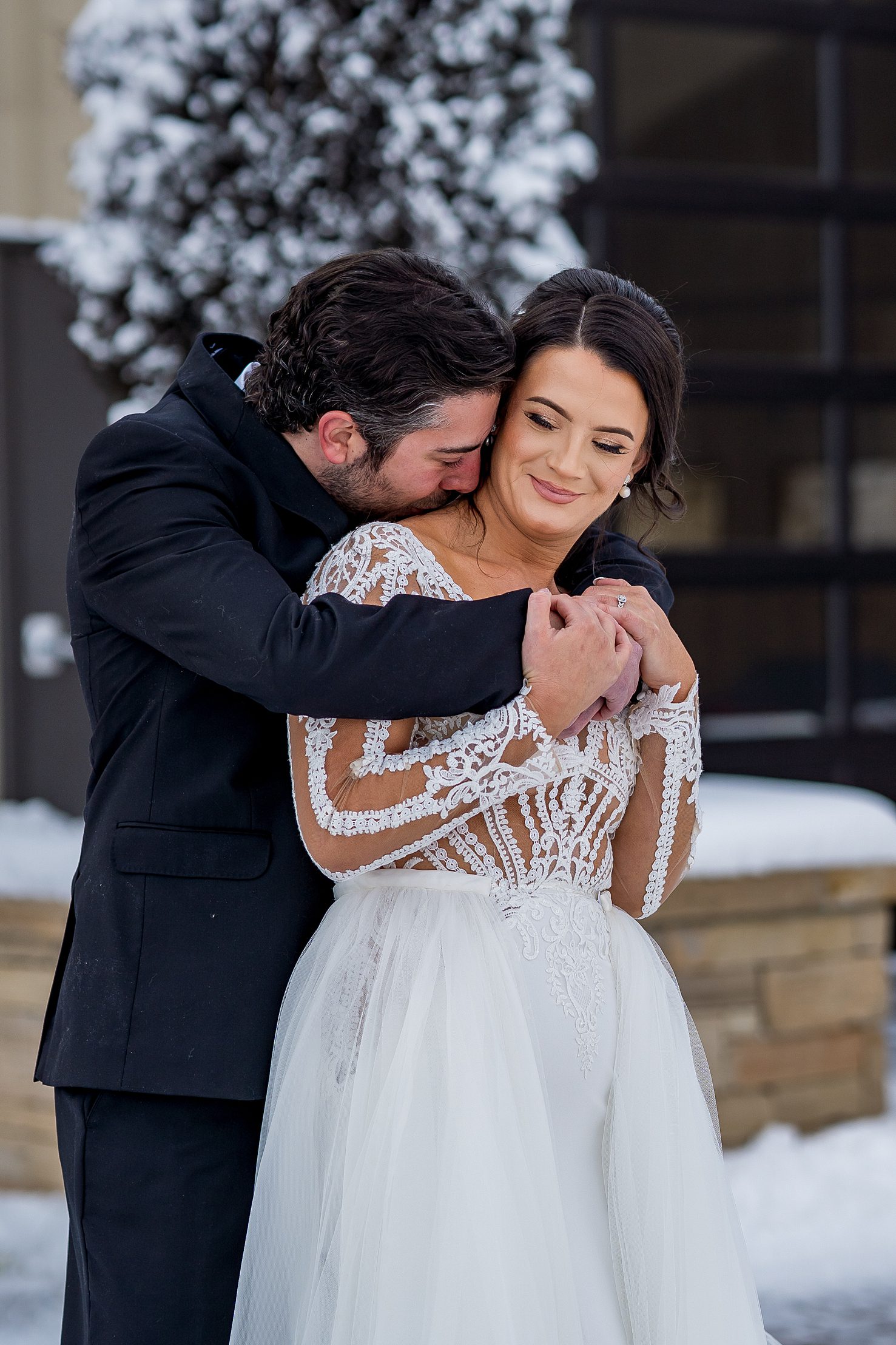 wedding couple snuggle up to each other