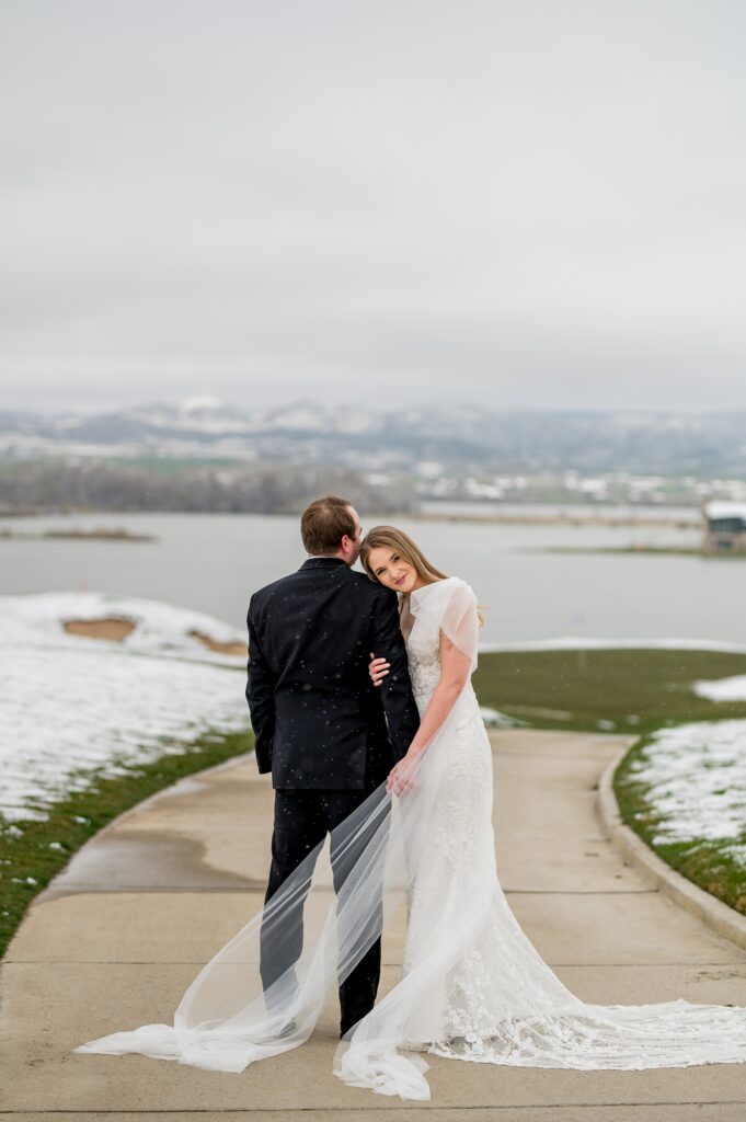 bride leaning her head agains grooms shoulder at TPC wedding venue.