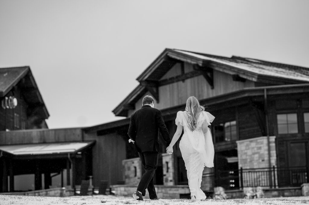 bride and groom walking back to TPC wedding venue