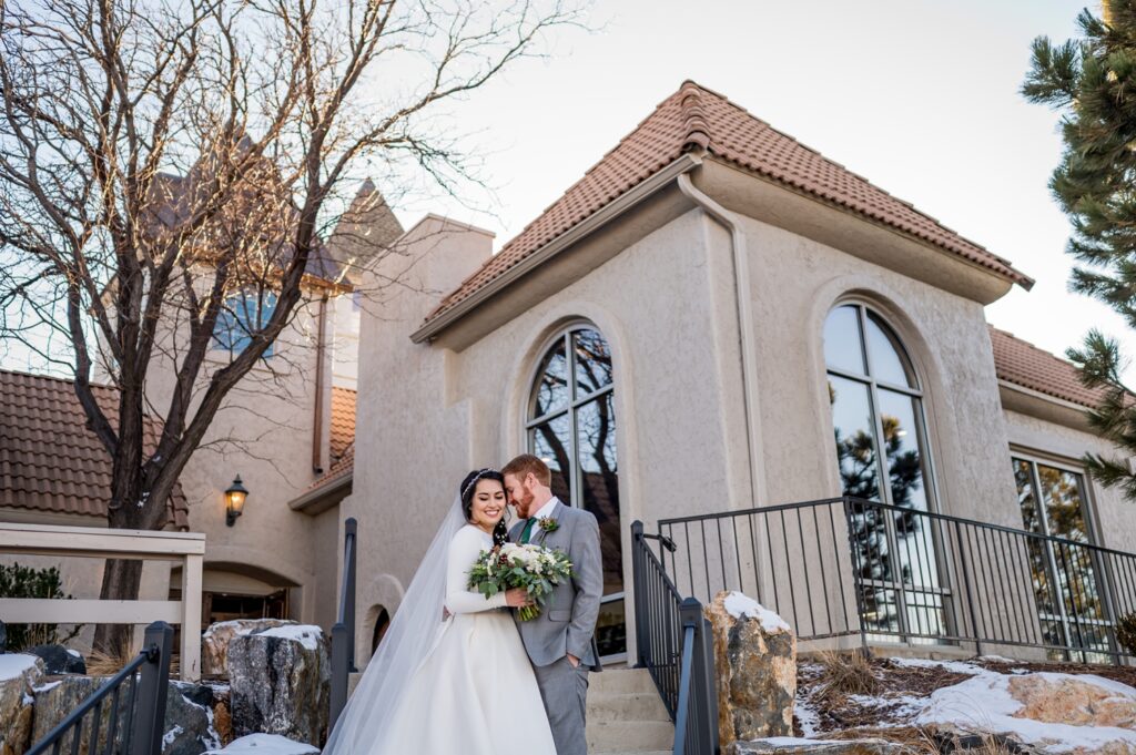 The bride and groom share a private moment before their ceremony in Denver, standing together in a quiet, intimate setting. The couple gazes at each other with love and anticipation, creating a peaceful and emotional moment before their wedding begins.