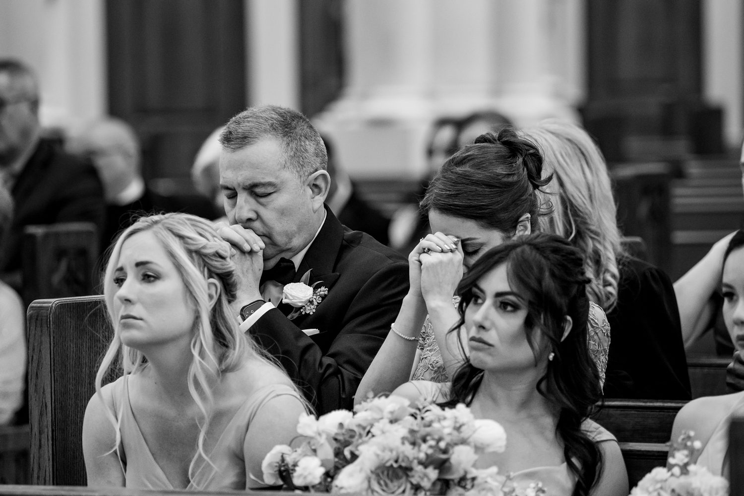 parents praying during wedding at Cathedral Basilica