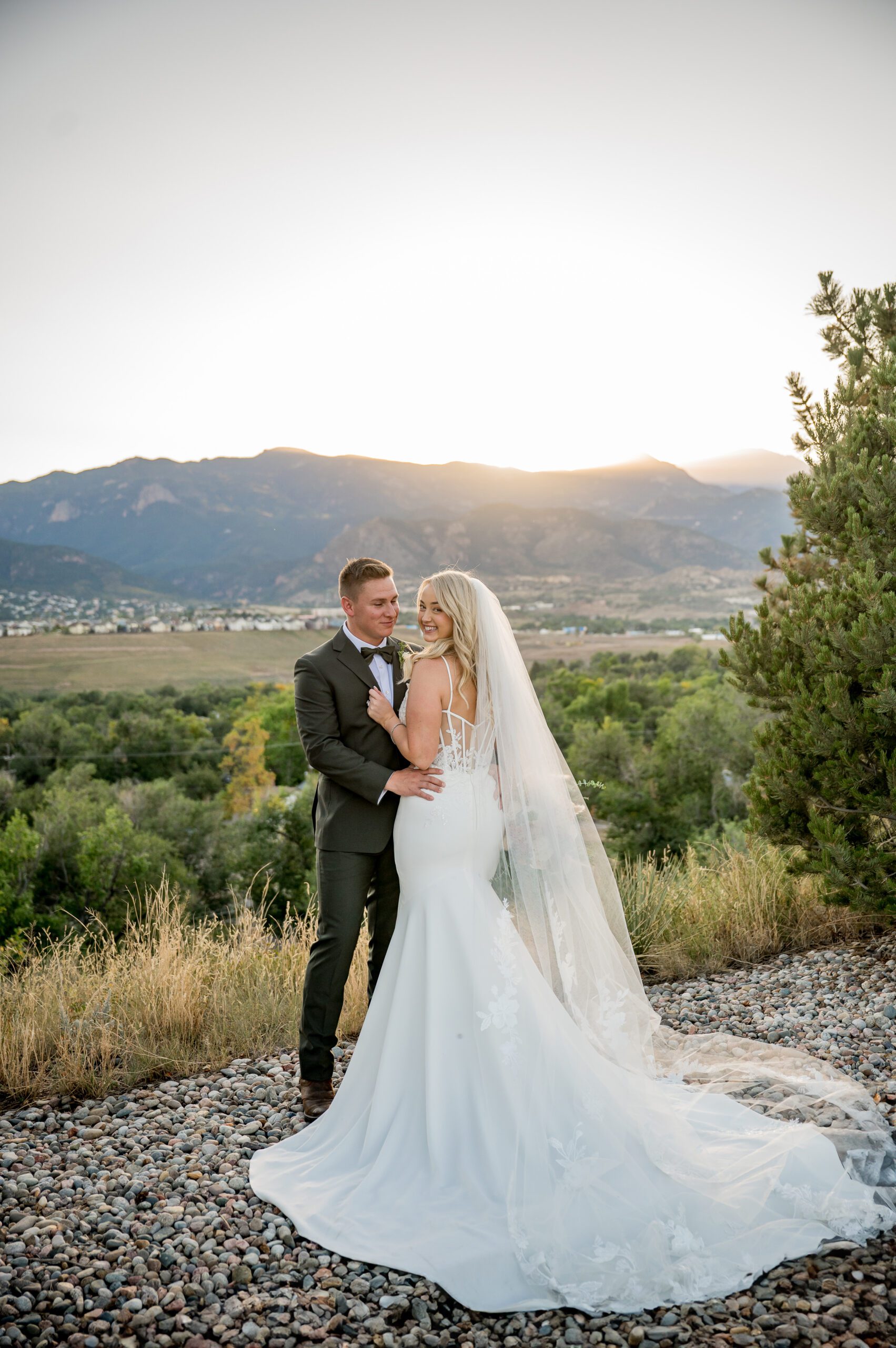 sweet moment of wedding couple during sunset at Pinery at The Hill in Colorado Springs.